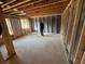 Unfinished basement with exposed ceiling, concrete walls and flooring and natural light from windows at 2515 Hogan Rd, East Point, GA 30344