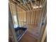 A bathroom is being constructed with a black shower base and wood studs at 2515 Hogan Rd, East Point, GA 30344