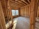 Framed-out bedroom with natural light and partial bathroom, new construction at 2515 Hogan Rd, East Point, GA 30344