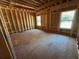 Unfinished framing of bedroom with window at 2515 Hogan Rd, East Point, GA 30344