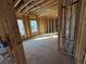 Framed-out bedroom with natural light and partial bathroom, new construction at 2515 Hogan Rd, East Point, GA 30344