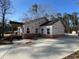 Side view of house with brick and siding construction under clear blue skies at 2515 Hogan Rd, East Point, GA 30344