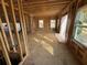 Unfinished construction showing open-concept living room framing with ample natural light from large windows at 2515 Hogan Rd, East Point, GA 30344