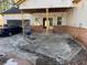 Outdoor covered patio space with exposed brick and a blue pickup truck parked outside at 2515 Hogan Rd, East Point, GA 30344