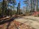 View of a clear lot with some construction remains under clear, blue skies at 2515 Hogan Rd, East Point, GA 30344