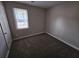 Comfortable bedroom with carpet flooring, neutral paint, and a window for natural light at 2921 8Th St, East Point, GA 30344