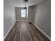 Well-lit bedroom with hardwood floors, neutral paint, and closet space at 2921 8Th St, East Point, GA 30344