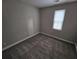 Bedroom with carpet flooring, neutral paint, and natural light through a bright window at 2921 8Th St, East Point, GA 30344