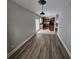 View of the dining room with hardwood floors, neutral walls, and direct access to the kitchen at 2921 8Th St, East Point, GA 30344
