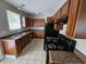 Traditional kitchen with wooden cabinets, granite countertops, and modern appliances at 2921 8Th St, East Point, GA 30344