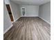 Spacious living room with modern hardwood floors, neutral paint, and plenty of natural light at 2921 8Th St, East Point, GA 30344