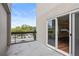 Private balcony with views of the street, city, and trees through a sliding glass door at 587 Virginia Ne Ave # 315, Atlanta, GA 30306