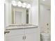 Bathroom featuring granite countertops, a modern vanity, and a shower with white tile surround at 587 Virginia Ne Ave # 315, Atlanta, GA 30306