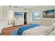 Bright bedroom features wood floors, a large window, and ensuite bathroom at 587 Virginia Ne Ave # 315, Atlanta, GA 30306