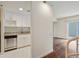 View of a kitchen featuring a stainless steel dishwasher, white cabinets and granite countertops at 587 Virginia Ne Ave # 315, Atlanta, GA 30306