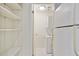 Laundry room with washer, dryer, and shelving storage at 587 Virginia Ne Ave # 315, Atlanta, GA 30306