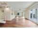 Spacious living room with wood floors, bar area, large mirror and access to balcony at 587 Virginia Ne Ave # 315, Atlanta, GA 30306