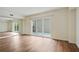 Open floor plan living room with sliding doors to a balcony and mirrored wall at 587 Virginia Ne Ave # 315, Atlanta, GA 30306