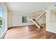 Bright living room featuring wood floors, a modern staircase and sliding glass doors to the patio at 587 Virginia Ne Ave # 315, Atlanta, GA 30306