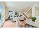 Inviting living room with wood floors, stylish furniture and a modern staircase at 587 Virginia Ne Ave # 315, Atlanta, GA 30306