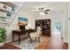 Home office space features hardwood floors, a ceiling fan, and a built-in bookcase at 587 Virginia Ne Ave # 315, Atlanta, GA 30306