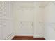 Walk-in closet with wood floors featuring installed wire shelving and closet doors at 587 Virginia Ne Ave # 315, Atlanta, GA 30306