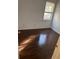 Bedroom featuring hardwood floors and a window at 12264 Crestwood Ct, Fayetteville, GA 30215
