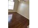 This bedroom has neutral walls and a large window at 12264 Crestwood Ct, Fayetteville, GA 30215