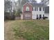 Charming two-story home features a brick and vinyl facade, well-maintained lawn, and inviting curb appeal at 12264 Crestwood Ct, Fayetteville, GA 30215