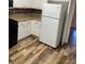 Kitchen featuring white cabinets, stainless steel appliances, and tile backsplash at 12264 Crestwood Ct, Fayetteville, GA 30215