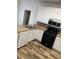 Kitchen featuring white cabinets, stainless steel appliances, and tile backsplash at 12264 Crestwood Ct, Fayetteville, GA 30215