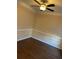 Bright living room featuring warm toned walls, hardwood floors, and a ceiling fan at 12264 Crestwood Ct, Fayetteville, GA 30215