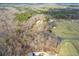 Aerial view of the home nestled within a wooded area, showcasing the landscape and surrounding neighborhood at 550 Oak Ridge Dr, Oxford, GA 30054