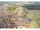 Aerial view of a 10-acre lot showing the house and surrounding mature trees at 550 Oak Ridge Dr, Oxford, GA 30054