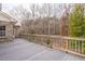 Wide backyard deck perfect for relaxation, views of lush greenery, and outdoor entertaining at 550 Oak Ridge Dr, Oxford, GA 30054
