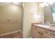 Bright bathroom featuring modern vanity, shower, and neutral decor at 550 Oak Ridge Dr, Oxford, GA 30054
