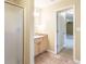 Attached bathroom featuring a standing shower and modern vanity at 550 Oak Ridge Dr, Oxford, GA 30054
