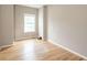 Bedroom with hardwood floors, neutral walls and a large window at 550 Oak Ridge Dr, Oxford, GA 30054