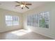 Inviting bedroom with large windows offering views of the surrounding trees at 550 Oak Ridge Dr, Oxford, GA 30054