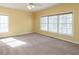 Bedroom featuring large windows and a ceiling fan at 550 Oak Ridge Dr, Oxford, GA 30054