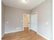 Bedroom with hardwood floors with view into hallway and closet at 550 Oak Ridge Dr, Oxford, GA 30054