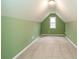Bonus room with a large window, neutral carpet, and a fresh coat of paint at 550 Oak Ridge Dr, Oxford, GA 30054
