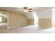 Bright bonus room featuring neutral carpet and ample natural light from a large window at 550 Oak Ridge Dr, Oxford, GA 30054