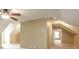 Open bonus room featuring neutral carpet and a ceiling fan at 550 Oak Ridge Dr, Oxford, GA 30054