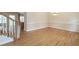 Dining room with hardwood floors, a chandelier, and views of the staircase at 550 Oak Ridge Dr, Oxford, GA 30054