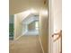 Hallway with neutral carpet leading to several rooms at 550 Oak Ridge Dr, Oxford, GA 30054