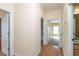 Bright hallway with hardwood floors connects various rooms in the home at 550 Oak Ridge Dr, Oxford, GA 30054