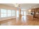 Spacious living room boasts hardwood floors, a ceiling fan, large windows, and an open layout at 550 Oak Ridge Dr, Oxford, GA 30054