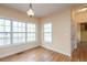 Bright sunroom features hardwood floors, multiple windows, and natural light at 550 Oak Ridge Dr, Oxford, GA 30054