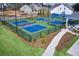 Aerial view of outdoor pickleball courts, surrounded by green space and neighborhood homes at 866 Lakemont Dr, Canton, GA 30114